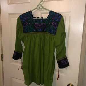 Green top with hand stitched detail at the top
